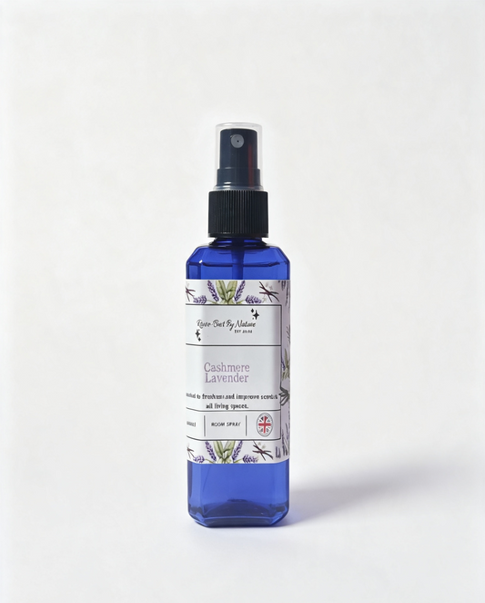 A blue spray bottle of cashmere Lavender room spray, featuring a white label with botanical illustrations, set against a plain white background.