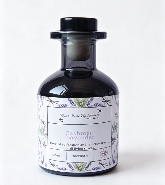 A dark glass diffuser bottle with a black stopper and a white label featuring lavender illustrations and the text 'Rowe-best By Nature' and 'Cashmere Lavender'.
